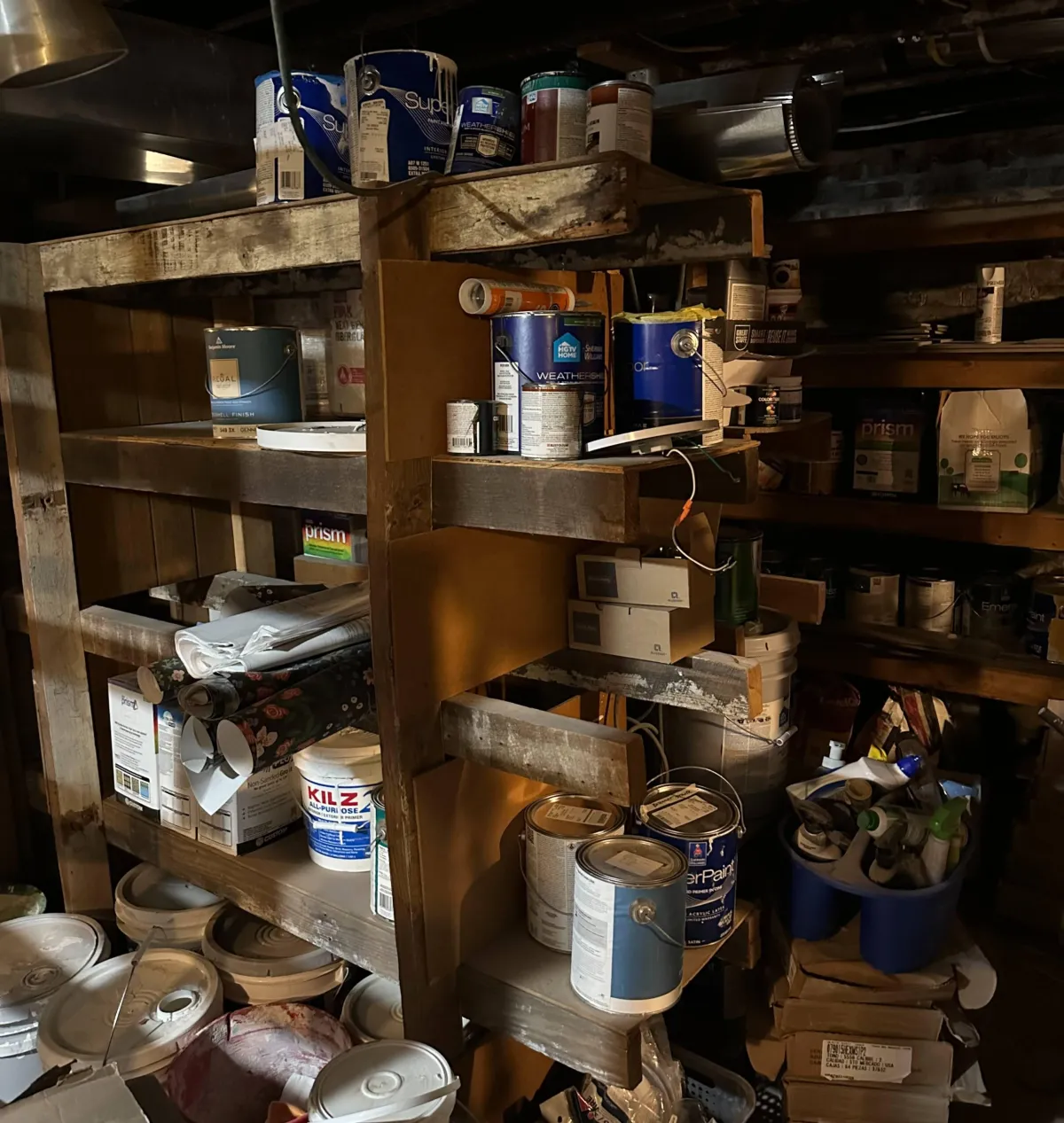 messy basement full of junk ready for estate cleanout service in troy mo