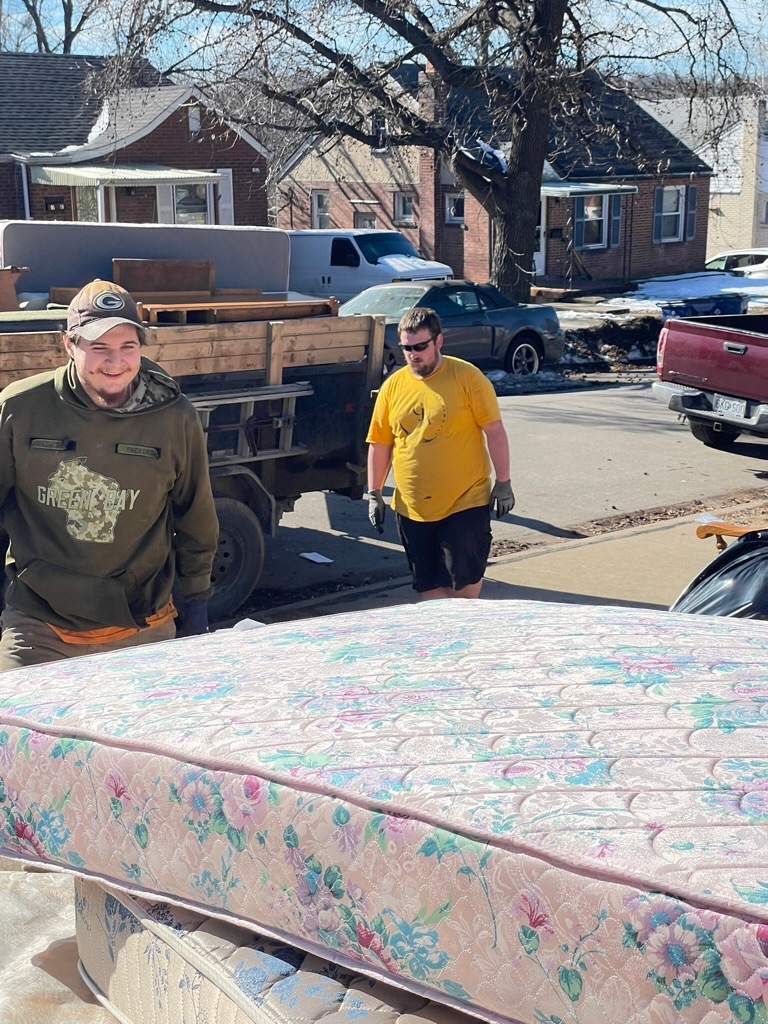Mattresses placed outside a home ready for professional mattress removal and junk hauling service in Troy, Missouri.